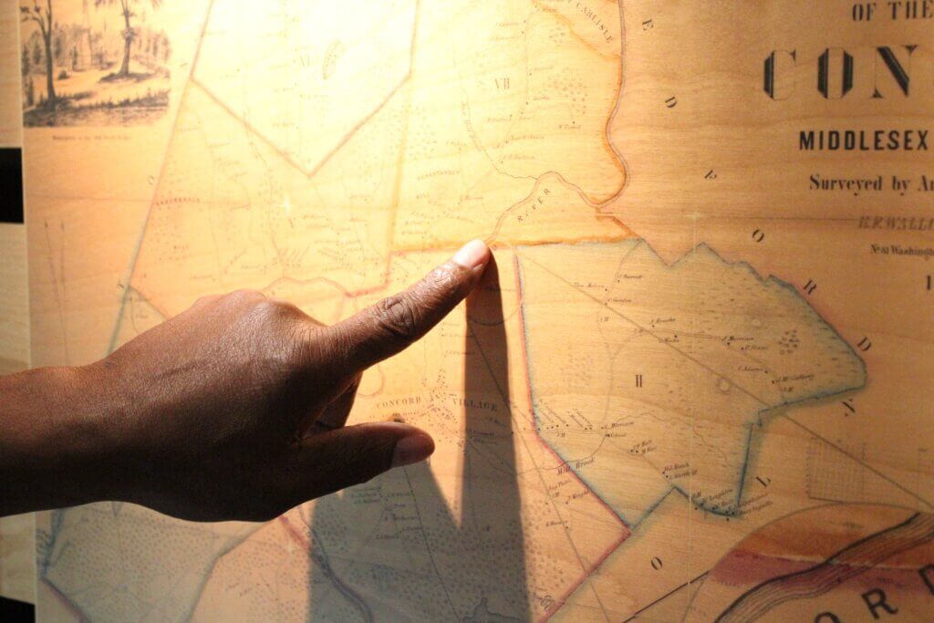 Robbins House interpreter Joe Zellner points to the spot on an 1850’s map where Caesar Robbins and other Black and Indigenous people once lived. Photo: Dakota Antelman/The Acton Bridge