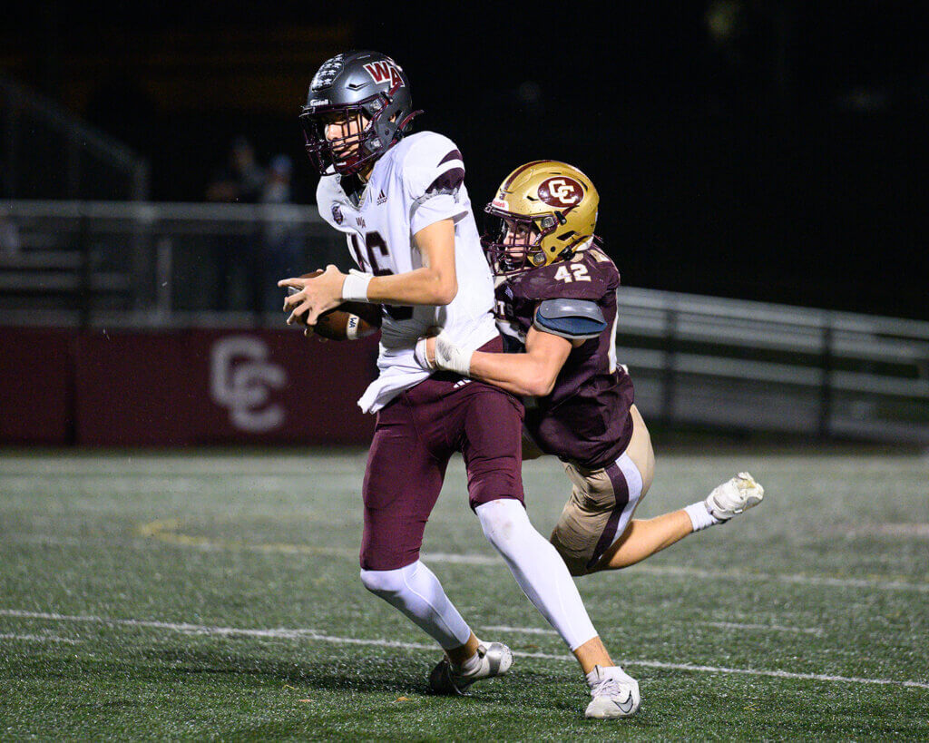 CCHS’ Ethan Rivas (No. 42) sacks Westford Academy quarterback Joey Guthrie (No. 16) during their October 16 game. Photo by Jon Straggas