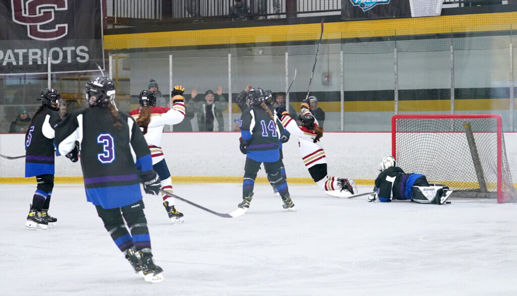 Ava Thomas and Pip Clinard celebrate the first goal of the game. Photo by Justina Wu
