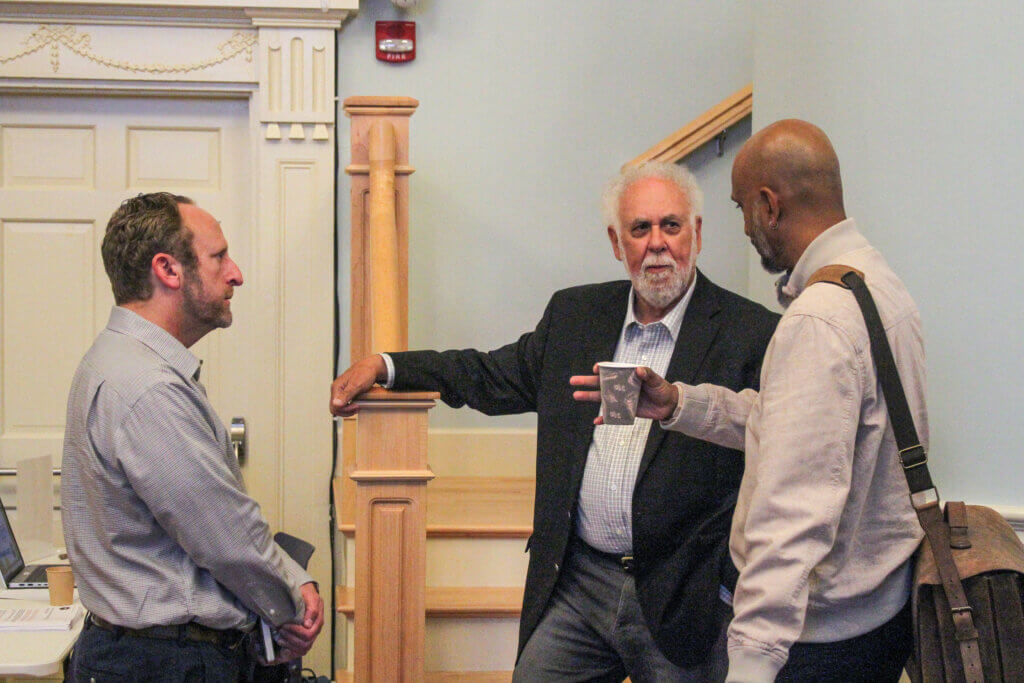 Left to right, Bias and Hate Incident Reporting Work Group members Daniel Hart, Paul Boehm, and Sandeep Pisharody speak before a public forum. Photo: Dakota Antelman/The Acton Bridge
