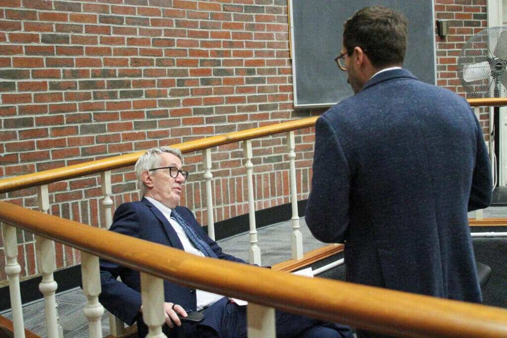 Defense attorney George King, left, speaks with Assistant District Attorney Nick Martin inside Acton District Court. Photo: Dakota Antelman/The Acton Bridge