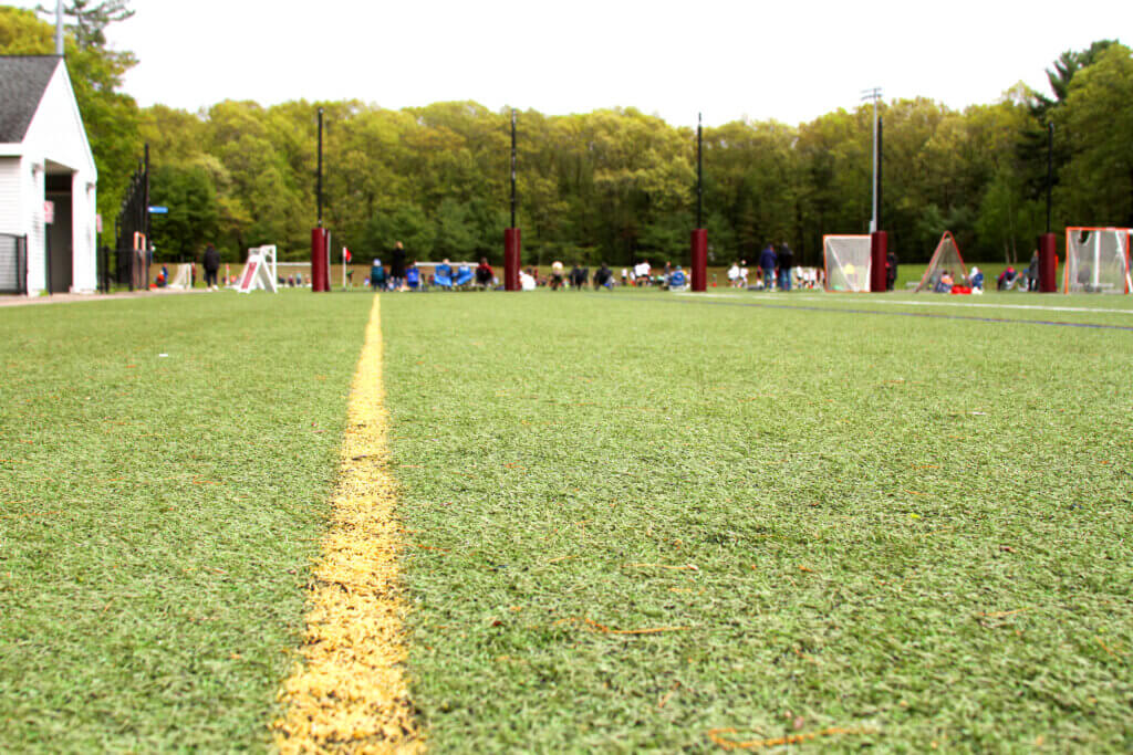 Stakeholders generally agree the current surface at the Doug White Fields is deteriorating and in need of replacement. Photo: Dakota Antelman/The Acton Bridge