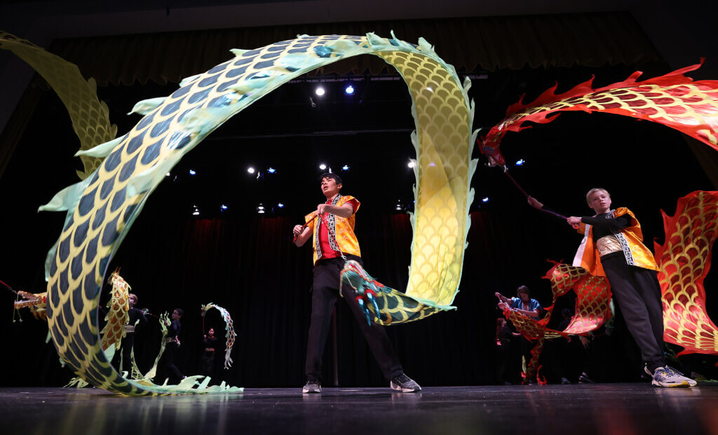 Acton-Carlisle senior Zachary Kulsa, left, performs the Dragon Ribbon Dance during the third annual Lunar New Year Celebration at Acton-Carlisle High School on Saturday, February 7, 2026. This year is the Year of the Horse. Ken McGagh/The Acton Bridge