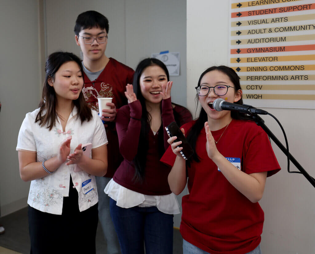 Sophomore Gracie Park, right, of the Acton-Carlisle Far East Association, kicks off the the third annual Lunar New Year Celebration with fellow Far East Association sophomores Phebe Lin, left, Oliver Kuo and Yeso Kim on Saturday, February 7, 2026. This year is the Year of the Horse. Ken McGagh/The Acton Bridge