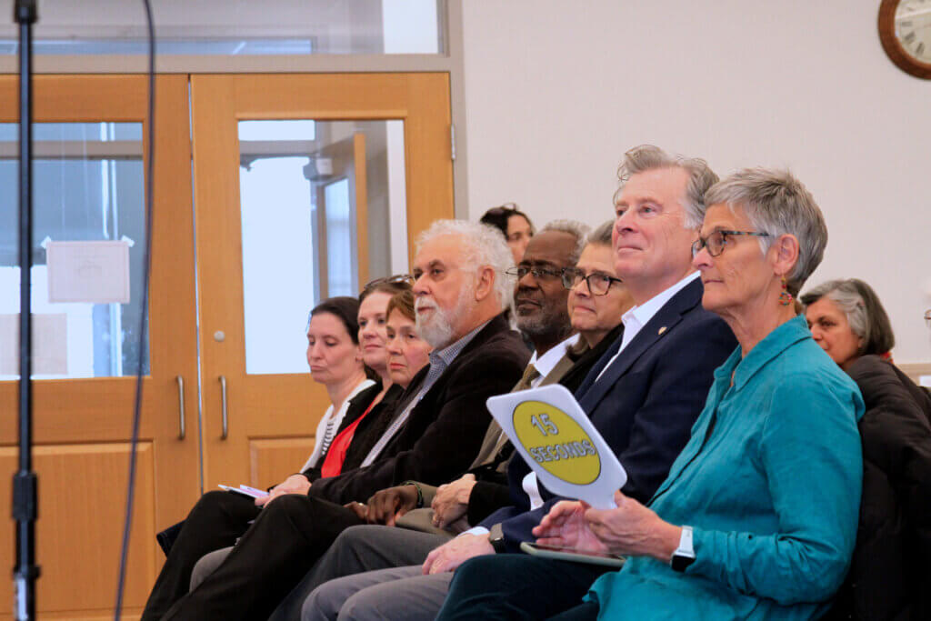 School Committee and Select Board candidates listen to introductions at a March 25 Council on Aging forum. Photo: Dakota Antelman/The Acton Bridge