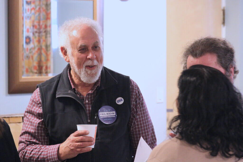 Select Board candidate Paul Boehm speaks with voters at a March 27 Acton Housing Authority meet-and-greet. Photo: Dakota Antelman/The Acton Bridge