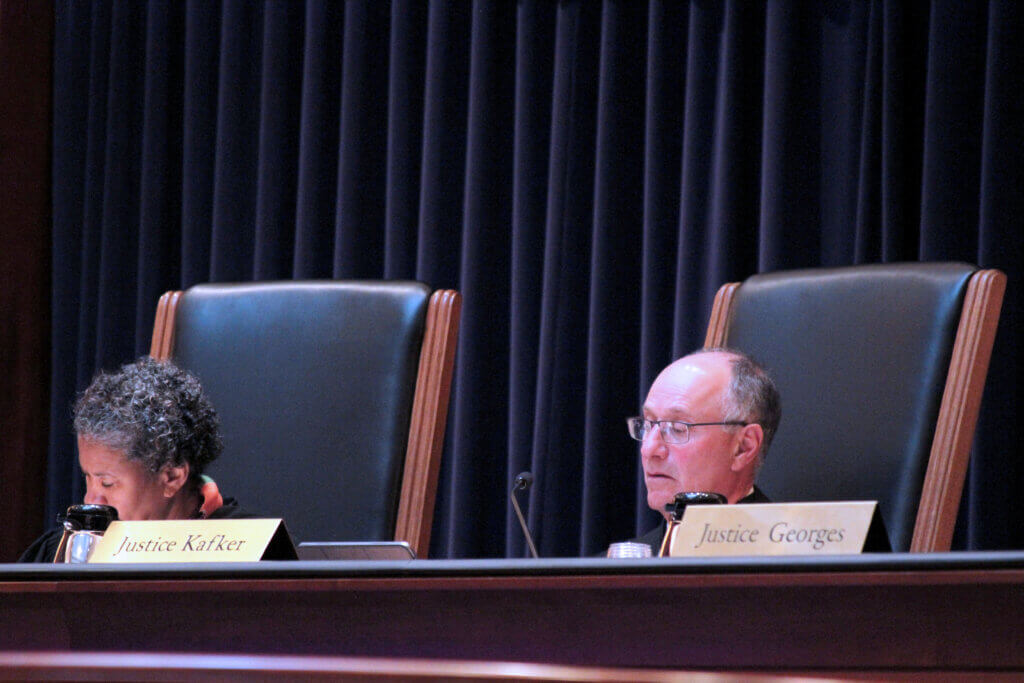 Chief Justice Kimberly Budd, left, and Justice Scott Kafker listen to oral arguments on May 7. Photo: Dakota Antelman/The Acton Bridge