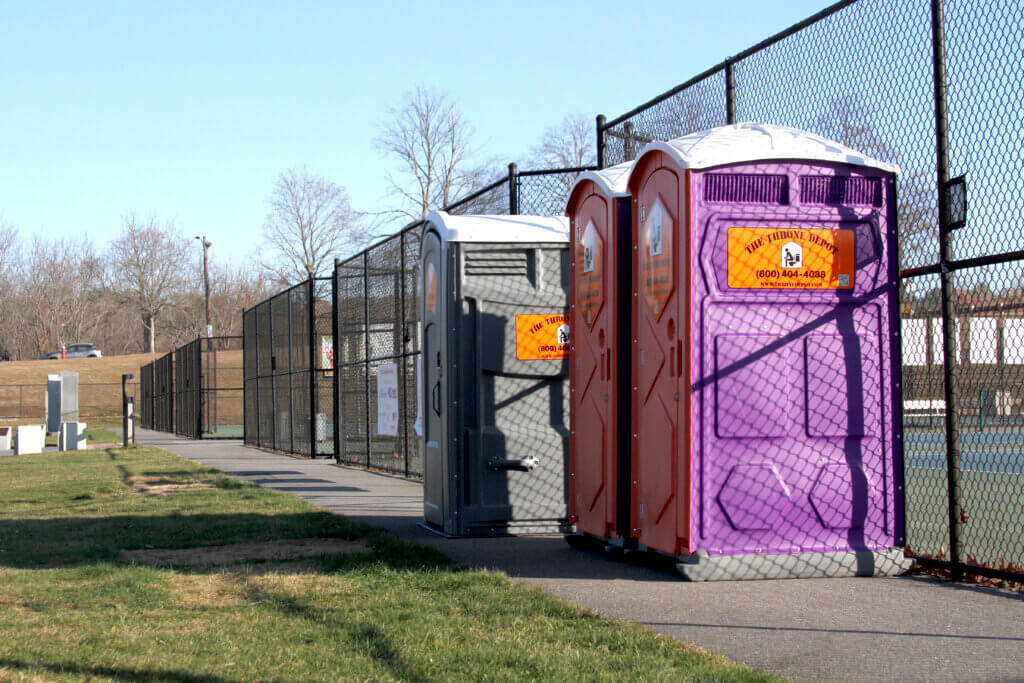 An envisioned amenities building would replace a trio of rented portable toilets at Acton-Carlisle High School’s Memorial Field Stadium. Photo: Dakota Antelman/The Acton Bridge