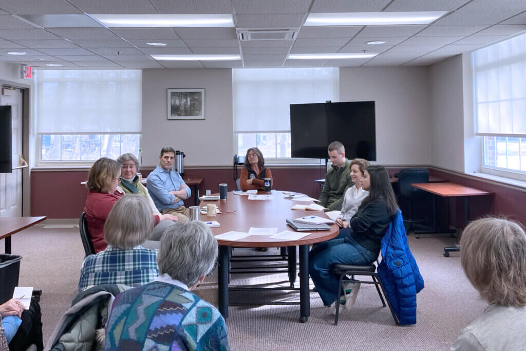 Sustainability director Eric Simms (third from left) said officials are “not particularly optimistic” about federal sustainability funding during a March 4 Conservation and Climate Coffee event. Photo: Dakota Antelman/The Acton Bridge
