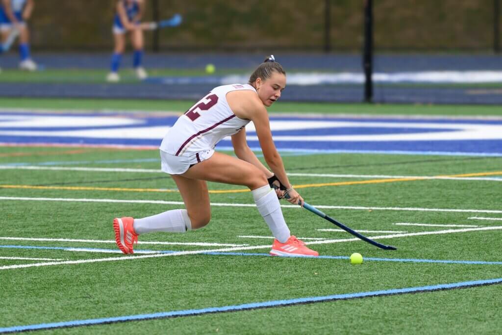 Patriots co-captain Zoë Bonzagni sweeps away a Bedford advance. Photo by David Clancy