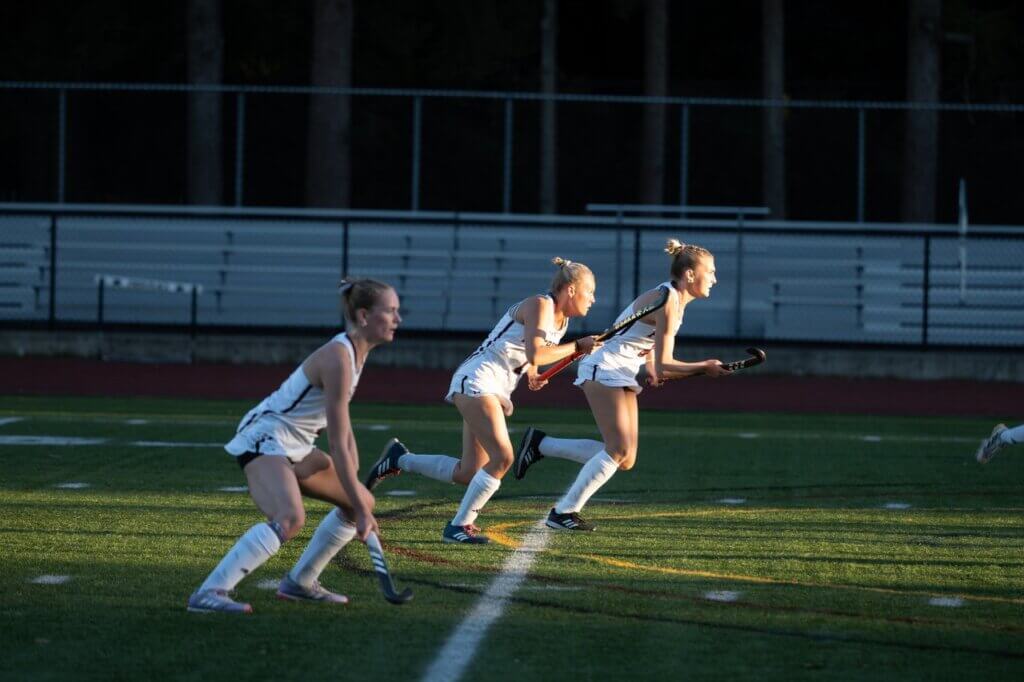 Abby Ruhmann, Lindsay Cain, and Scarlett Mirak sprint into action. Photo by David Clancy