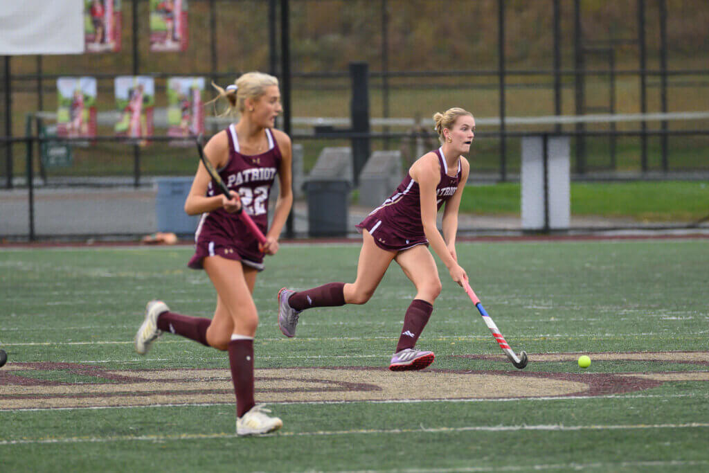 Midfielder Abby Ruhmann pushes forward against Westford Academy with Bridget Fivek on the wing during their October 13 game. Photo by David Clancy