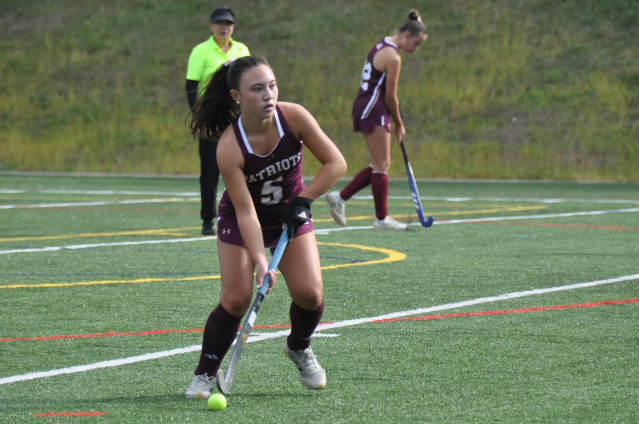 Maddie Clancy takes a free hit. Photo by David Clancy