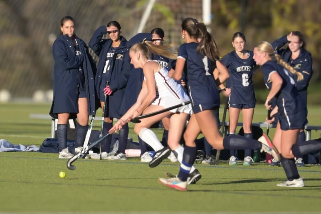 Scarlett Mirak threads the needle against Needham on October 24. Photo by David Clancy