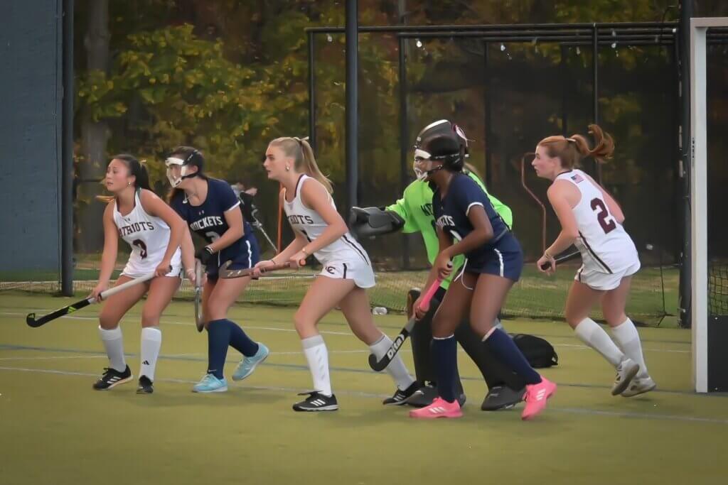 Ceci Clancy, Scarlett Mirak, and Julia Reynolds pressure the Needham defense. Photo by David Clancy