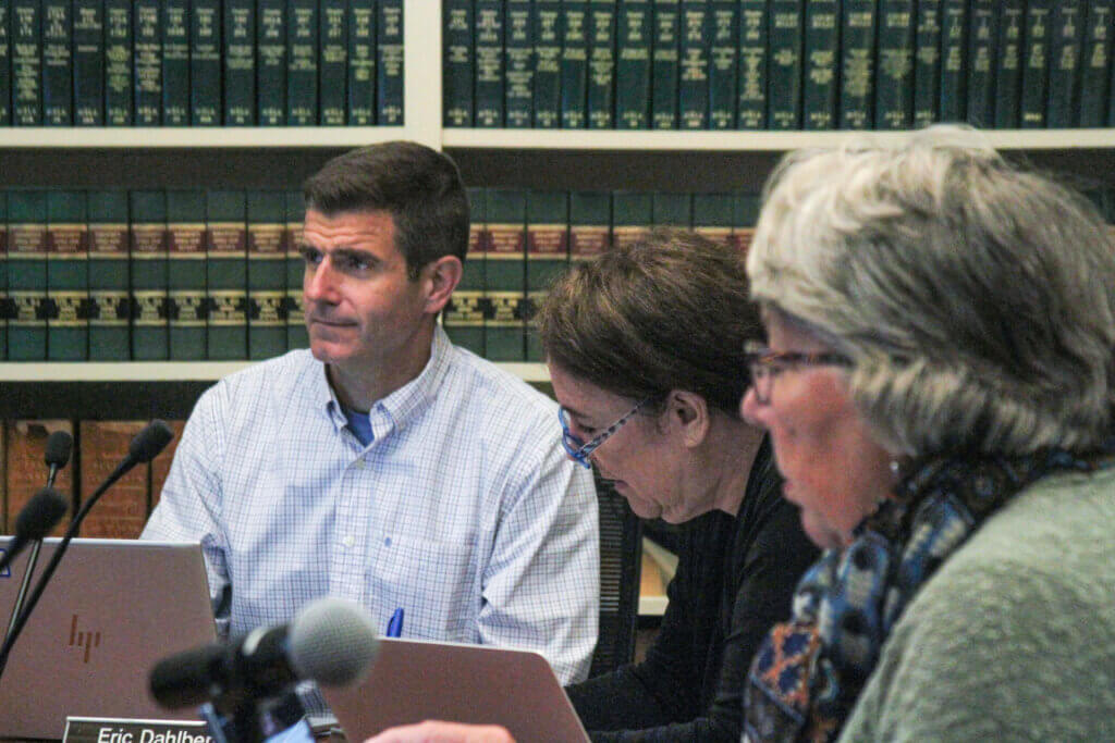 Finance Committee member Eric Dahlberg, left, listens during an October 30 FinCom meeting. Photo: Dakota Antelman/The Acton Bridge