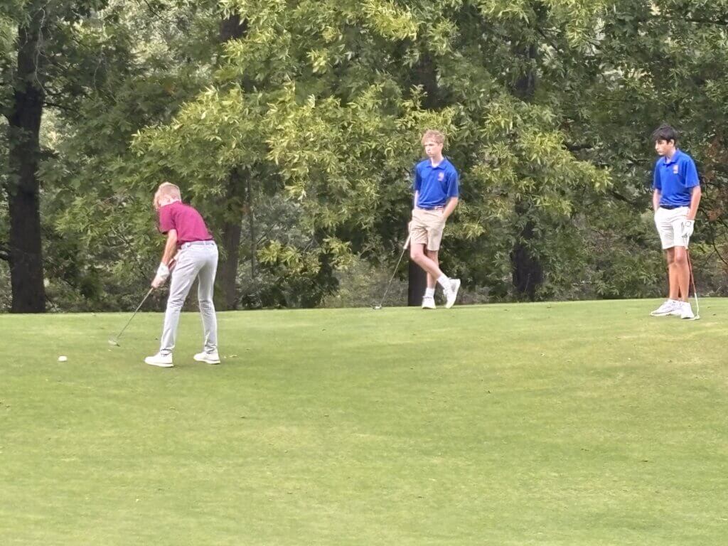 Ben Brooks lags his putt toward the seventh hole at Newton Commonwealth Golf Club. Photo by Carl Sweeney