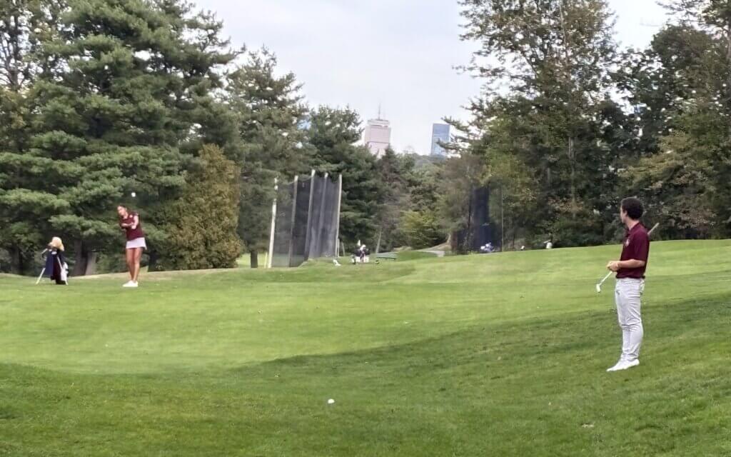 Sophie Redmond launches a wedge shot to the flag on the seventh hole. Photo by Carl Sweeney
