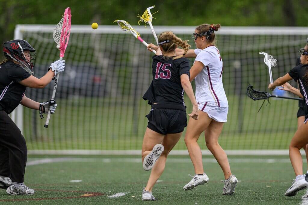 Patriots senior co-captain Sarah Fortier (No. 7) shoots on goal. Photo by Jon Straggas