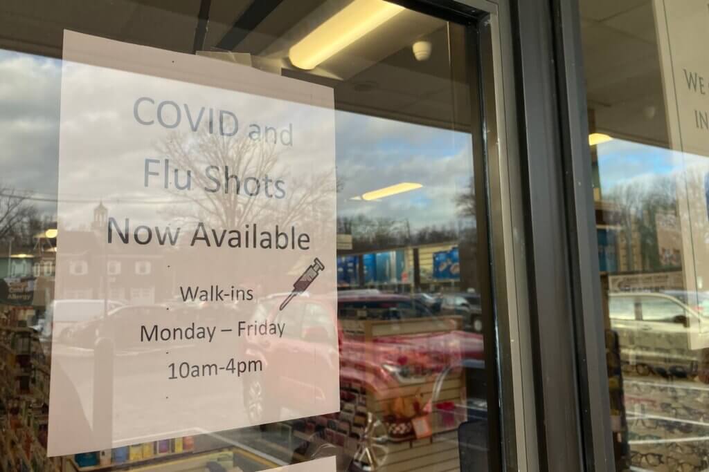 A sign at West Acton Pharmacy advertises flu and Covid vaccinations. Photo: Dakota Antelman/The Acton Bridge