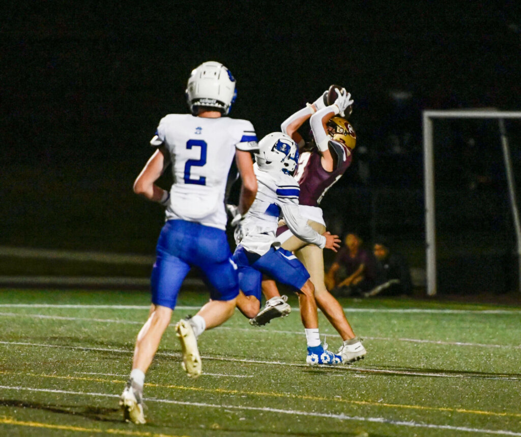 CCHS receiver Cam Sones makes a touchdown catch against Bedford on October 2. Photo by Cris Van Dyke