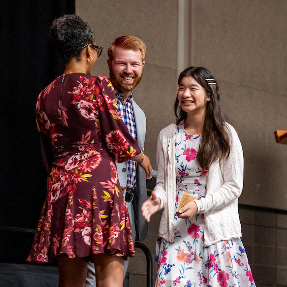 Allison Lu, right, accepts her scholarship in Phoenix. Photo courtesy of NAHRO