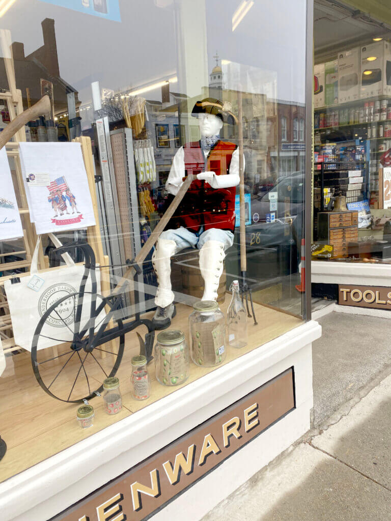 Display of minute man and plow in the front window of Vanderhoof Hardware. The hat, vest, and leggings belonged to Scott's father. Photo by Margaret Carroll-Bergman

