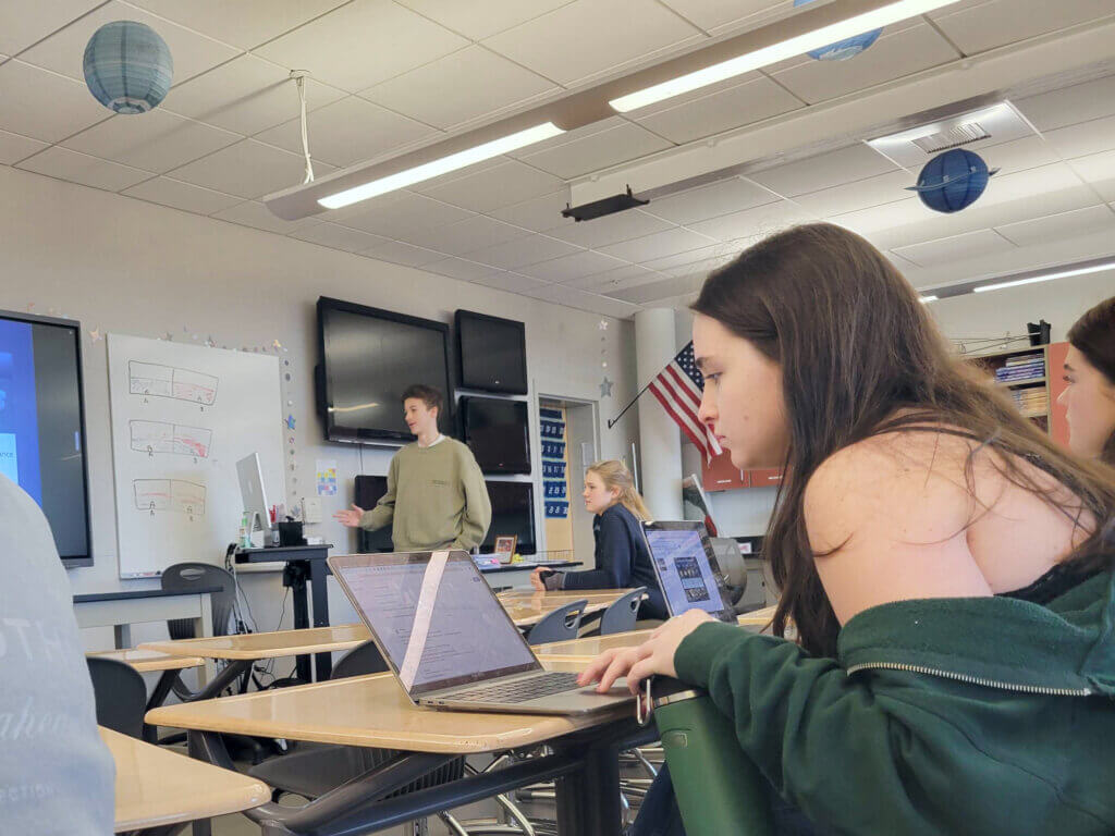 Elliot Hopkins, club vice president, talks fellow members through the week’s forecast. Photo: Trace Salzbrenner/The Acton Bridge