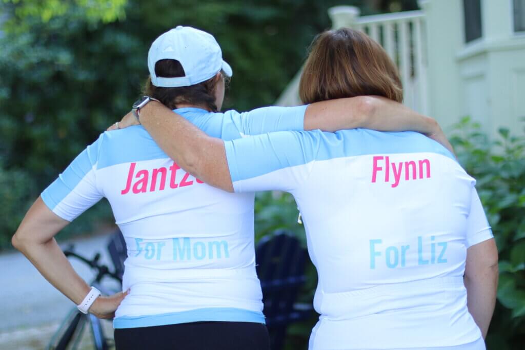 Denise Jantzen and Cheryl Flynn got matching jerseys to wear while riding in the Pan-Mass Challenge. They call themselves the Golden Gear Girls. Photo: Trace Salzbrenner/The Acton Bridge