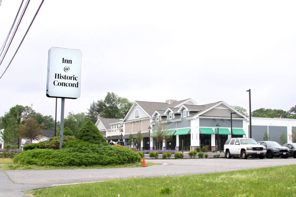 A new plaza has risen in place of the Papa Razzi trattoria since the state opened its emergency shelter at the former Best Western Historic Acton in 2023. Photo: Dakota Antelman/The Acton Bridge