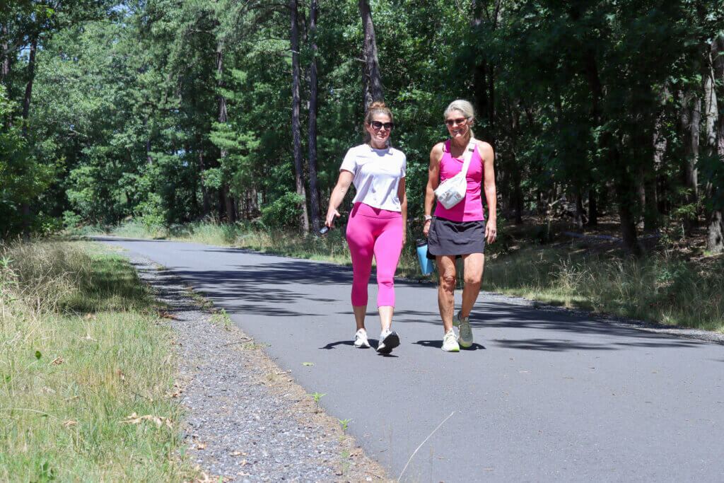 Vanessa Bassett and Lainchen Friese walk along the Bruce Freeman Rail Trail a week before the park’s official opening. Photo: Trace Salzbrenner/The Acton Bridge