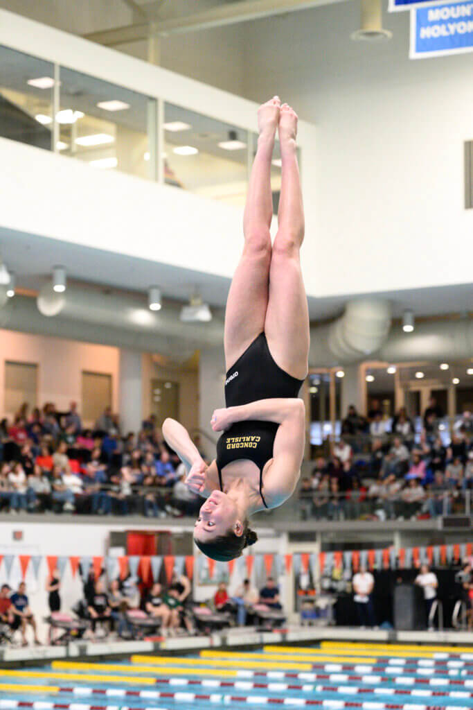 Audrey Herz displays the grace and technique that won her first place in last Saturday’s MIAA Division 1 diving competition at MIT and helped Acton-Carlisle High School capture its third straight state championship. Photo by Jon Straggas
