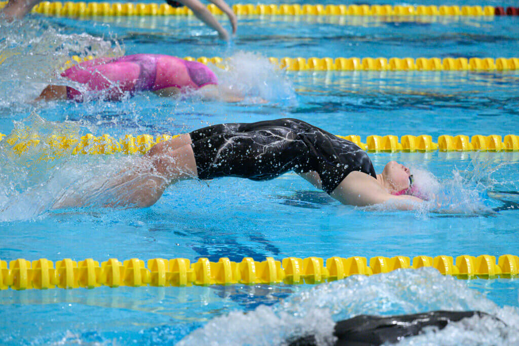 Phoebe Renyi starts the 200-yard medley relay in last Saturday’s MIAA Division 1 showdown at MIT. She and teammates Mena Sheth, Sarah Fortier, and Aela Bruno posted a fourth-place finish. Photo by Jon Straggas