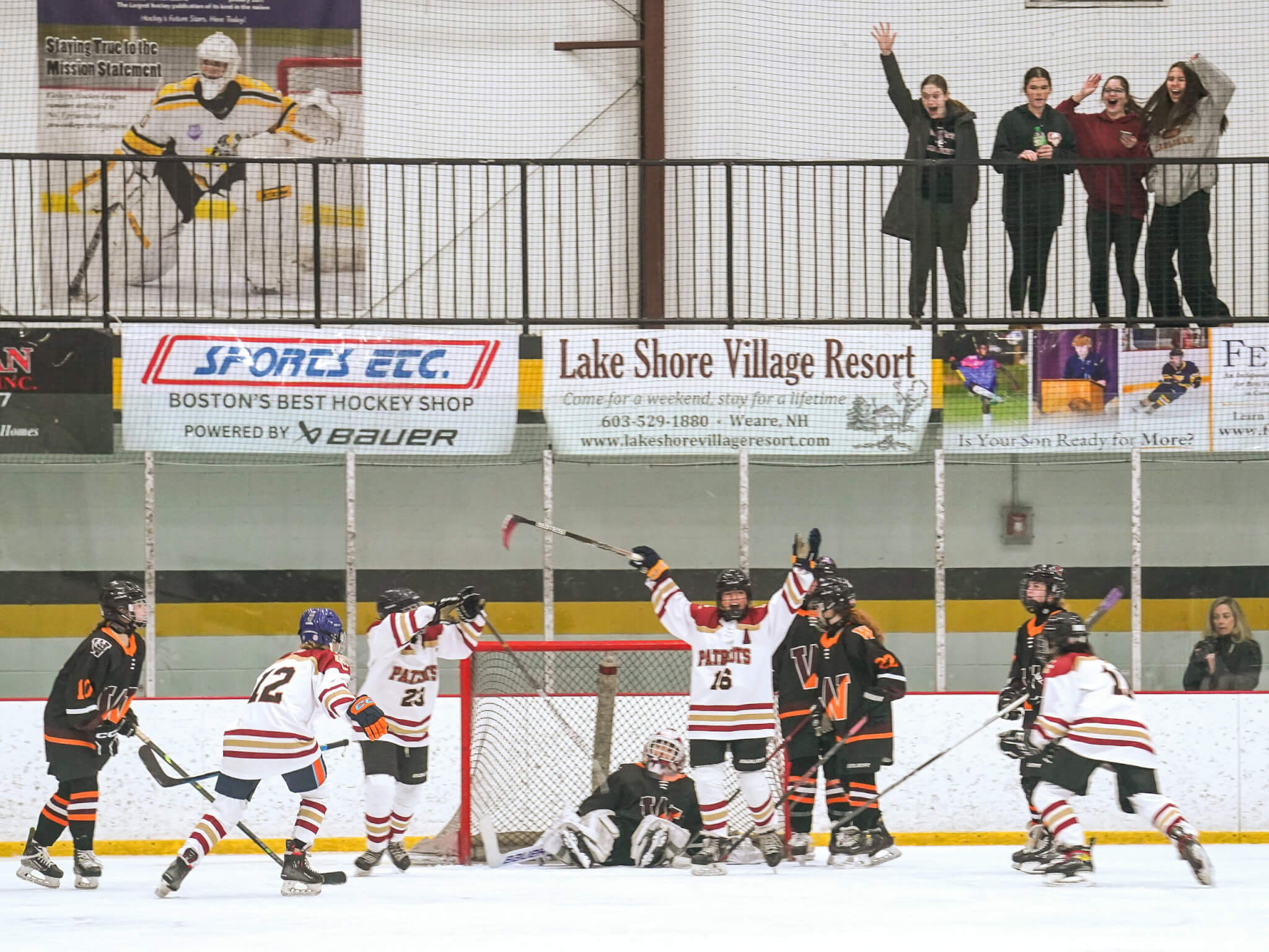 The Pats celebrate a goal after a scramble in the crease. Photo by Tina Wu