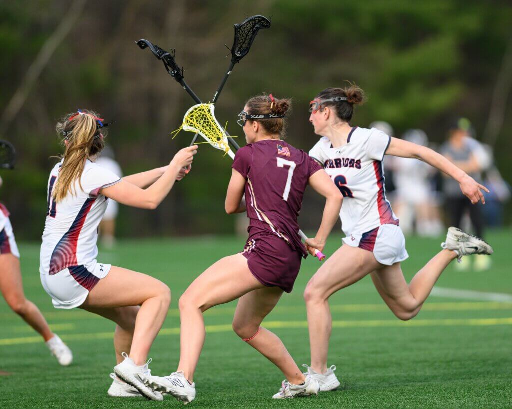 Acton-Carlisle co-captain Sarah Fortier (No. 7) scores the tie-breaking goal over Lincoln-Sudbury on April 16. Photo by Jon Straggas