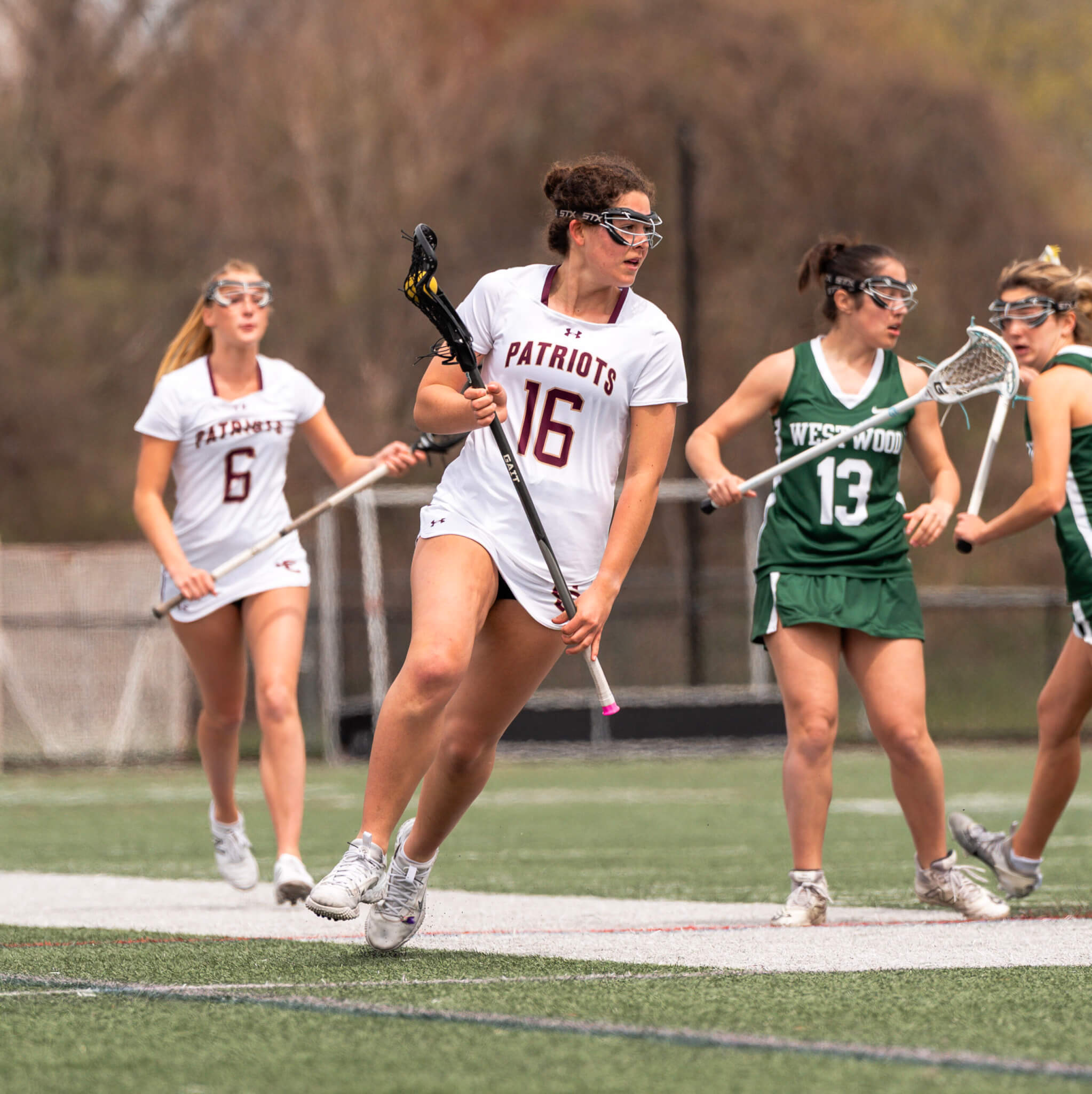 Ella Benvenuto (No. 16) runs the clear upfield against Westwood on April 25. Photo by Aidan Moroney