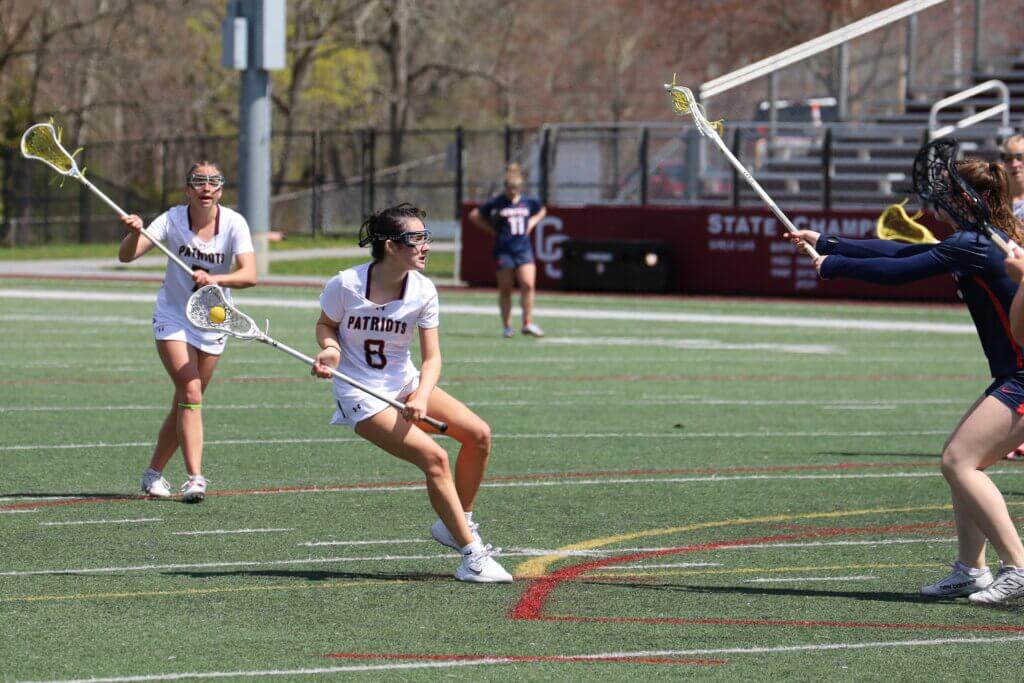 Hannah Feloney (8) hits the brakes to cut on her way to goal during the April 23 match against Central Catholic. Photo by Jason Fortier