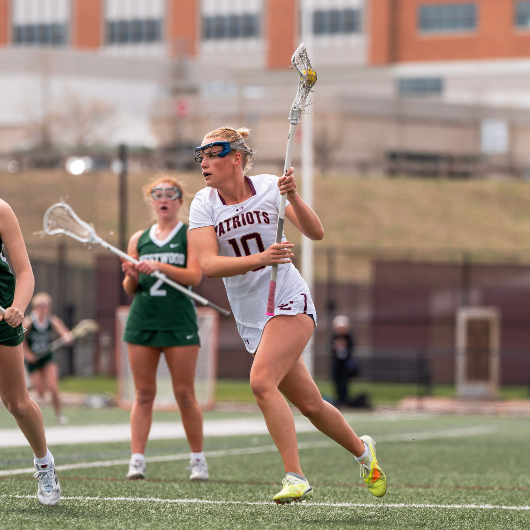Lindsay Cain (No. 10) rushes past Westwood defenders on her way to the goal on April 25. Photo by Aidan Moroney