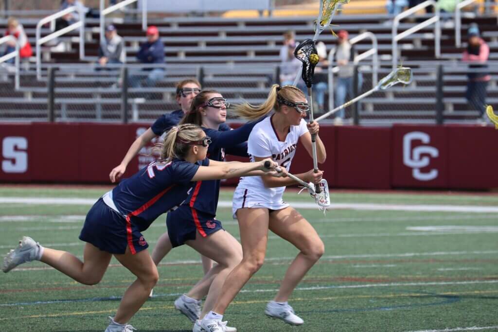 Scarlett Mirak dodges through three Central Catholic defenders on her way to the goal on April 23. Photo by Jason Fortier