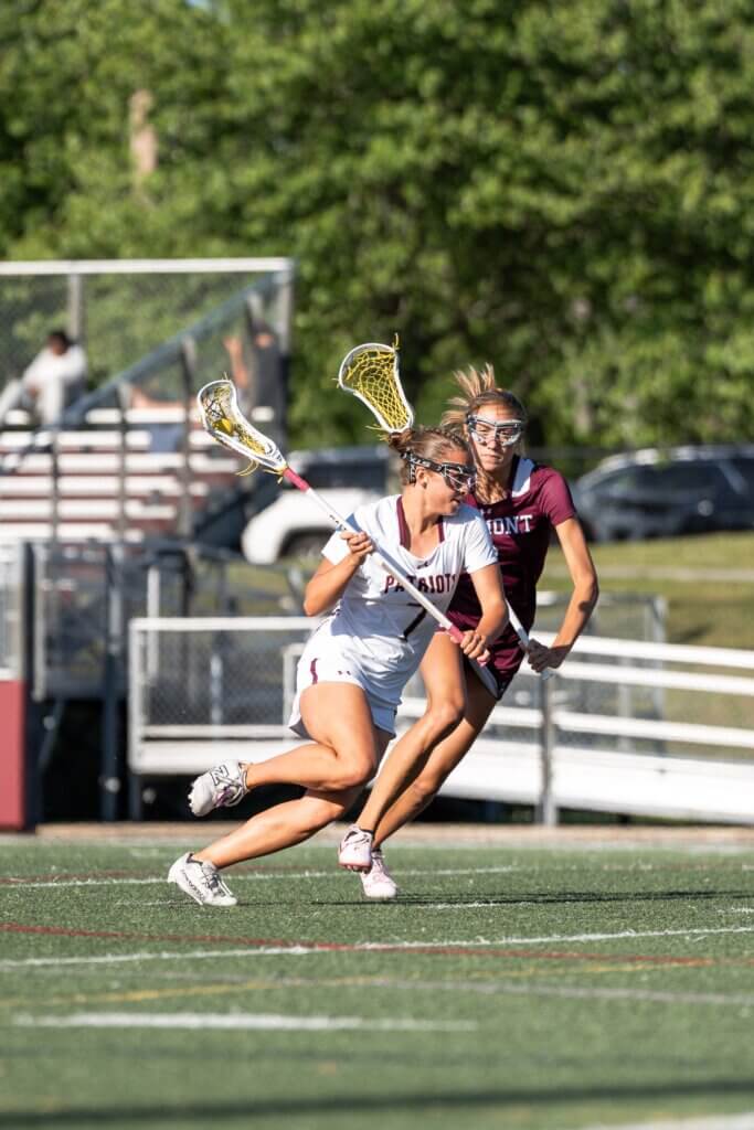 Sarah Fortier drives past a Belmont defender. Photo by Aidan Moroney
