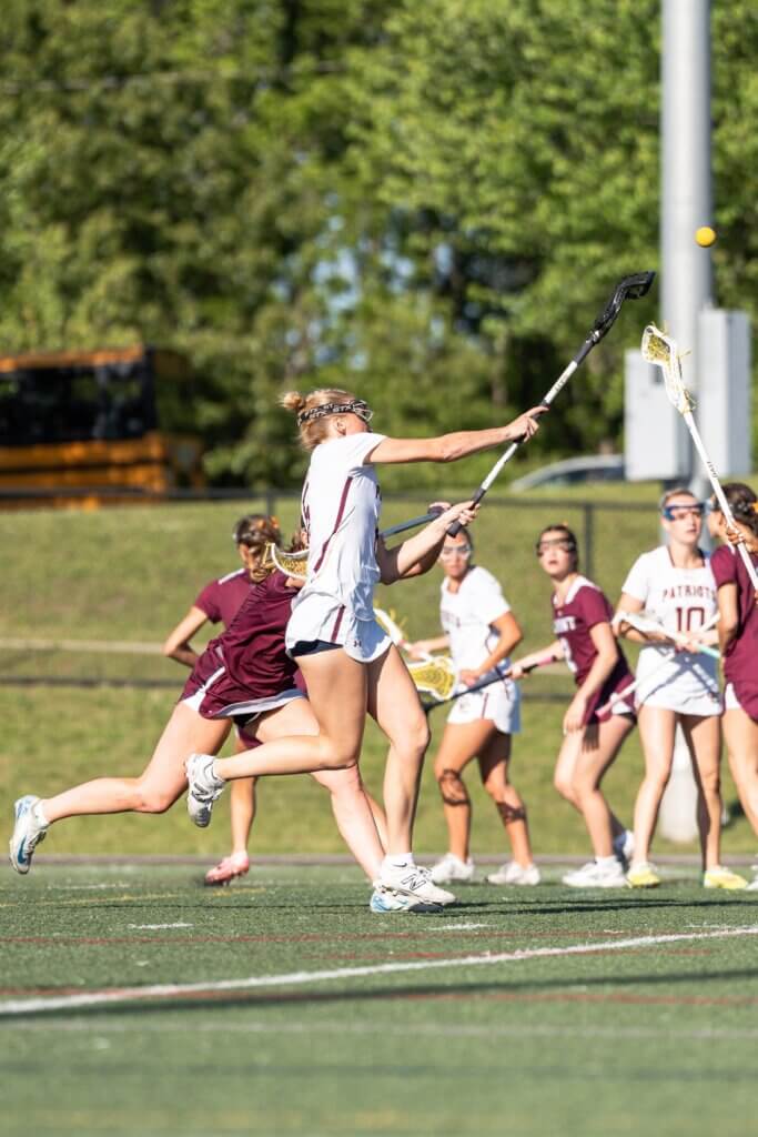 Scarlett Mirak fires one of her seven goals on the day in the Patriots’ 19-6 win over Belmont. Photo by Aidan Moroney
