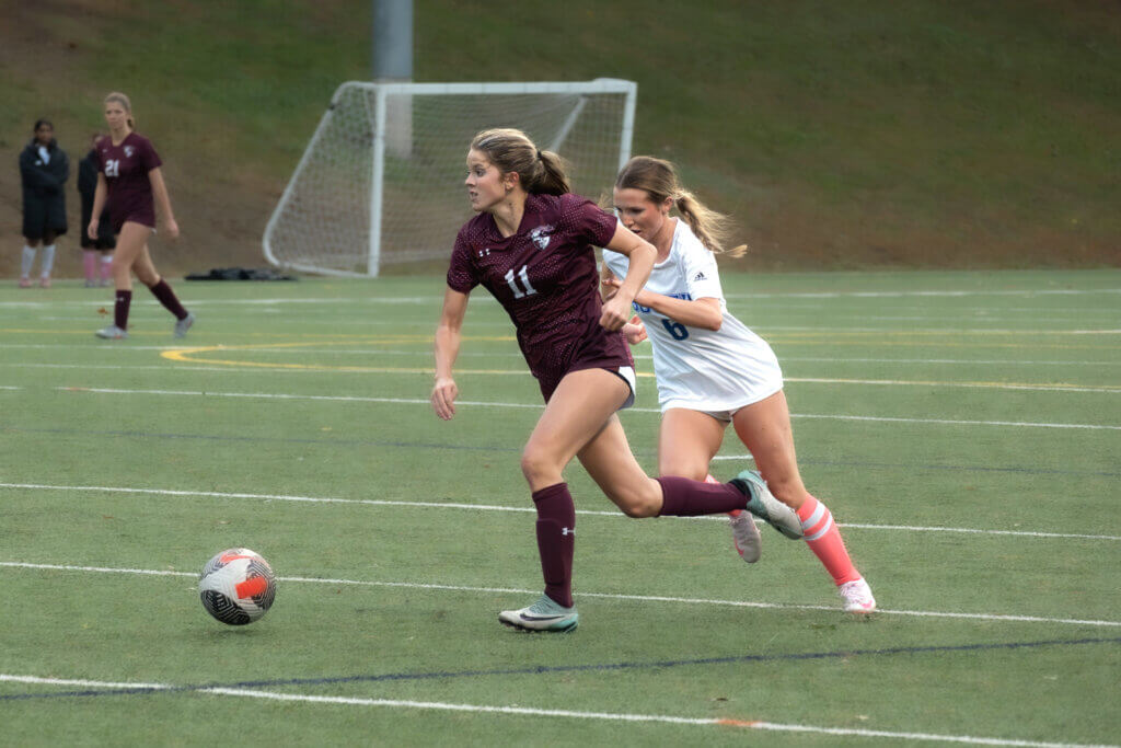 Emmy O’Donnell powers ahead against Newton South on October 14, a match in which she scored twice. Photo by David Clancy