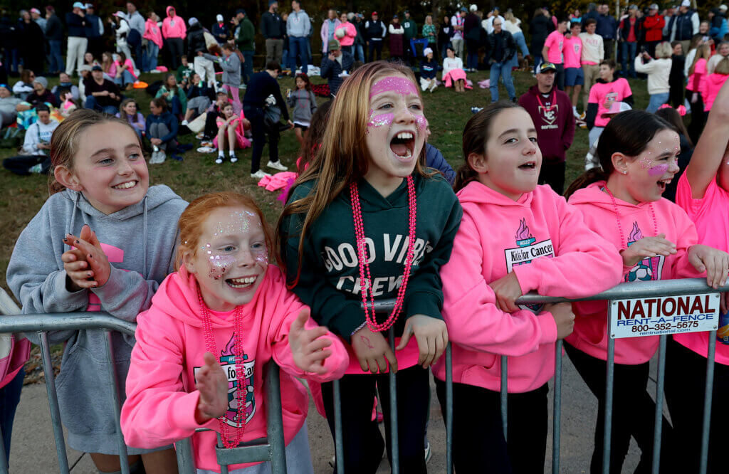 Young fans cheer after the girls team’s 5-0 Kicks for Cancer victory.