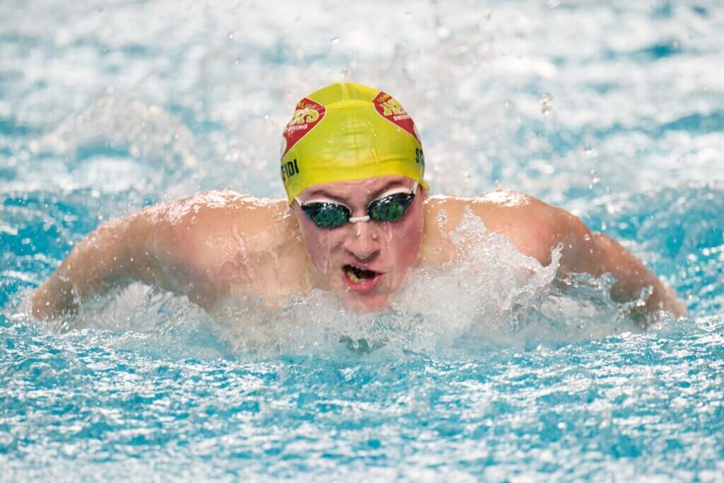 Cole Scafidi swims the 100-yard butterfly on January 6 against Cambridge Rindge and Latin. Photo by Jon Straggas