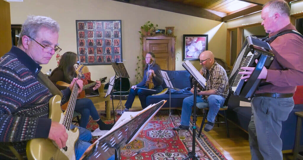 Noah Mendelsohn, far left, plays bass alongside Anna Huckabee Tull, Kristin Moore, Mickey Zibello, and accordionist Dave Carter. Courtesy photo