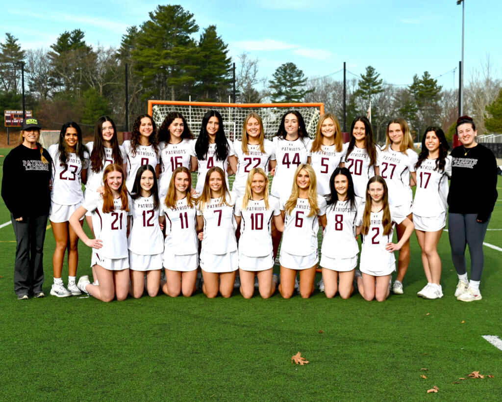 The 2025 Acton-Carlisle varsity girls lacrosse team. Front row: Julia Reynolds, Maya Feloney, Alex Skelly, Sarah Fortier, Lindsay Cain, Scarlett Mirak, Hannah Feloney, and Maisie Martinez. Back row: coach Erin Cash, Suhani Khandelwal, Grace Holsinger, Alissa Bono, Ella Benvenuto, Aubrey Monaghan, Karleigh Mutch, Alex Hooven, Teagan Morrissey, Vivi Myles, Lizzie Sproule, Isabella Cuoto, and coach Caitlyn Brennan. Photo by Kara Lyons
