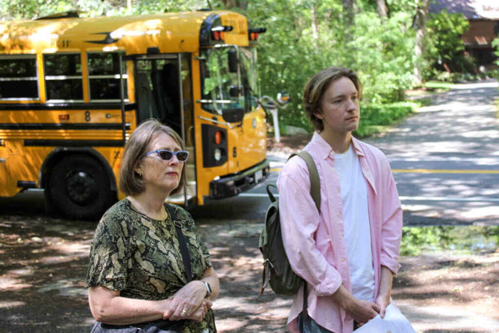 Economic Vitality Coordinator Mimi Graney, left, and Concordian Grady Flinn listen during a trail marker bus tour. Photo: Dakota Antelman/The Acton Bridge