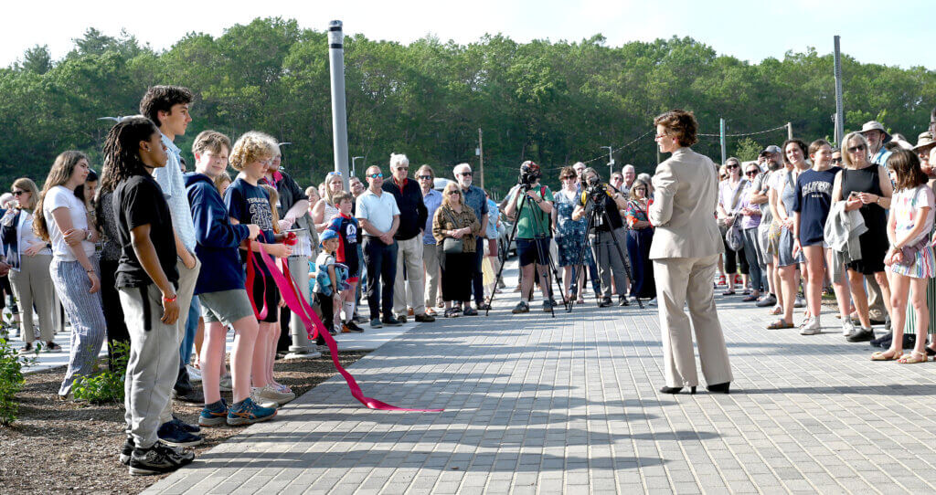 Laurie Hunter, Superintendent of Schools, speaks as a large crowd gathers for the ribbon cuttting for the Ellen Garrison Building at Acton Middle School on Wednesday, June 11, 2025. Ken McGagh/The Acton Bridge