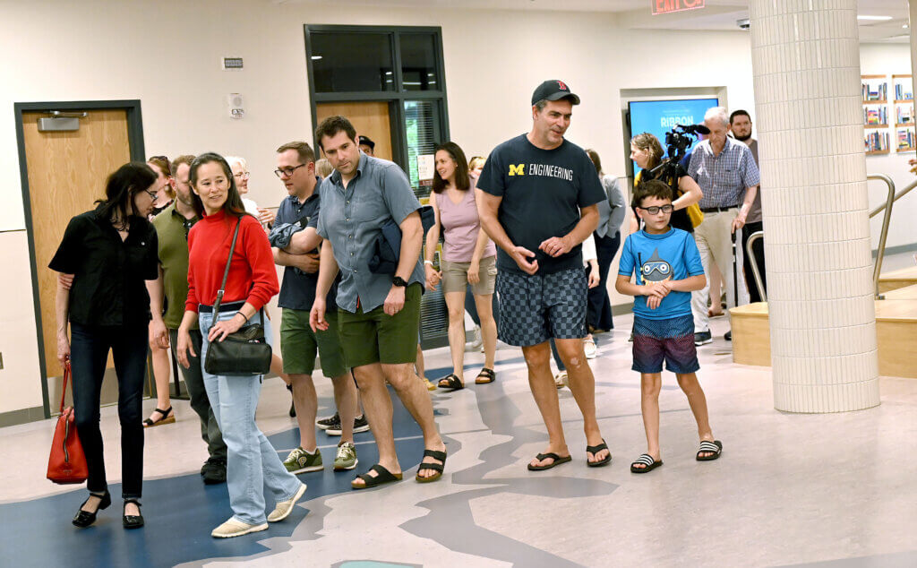 Residents make their way to the auditorium at the new Ellen Garrison Building at Acton Middle School following a ribbon cutting on Wednesday, June 11, 2025. Ken McGagh/The Acton Bridge