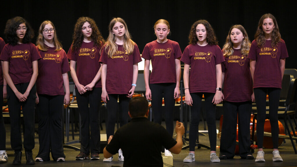 The Acton Middle School honors choir sings “Here Comes the Sun” by George Harrison during a program in celebration of the Ellen Garrison Building at Acton Middle School on Wednesday, June 11, 2025. Ken McGagh/The Acton Bridge